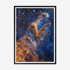 an image of the pillars in the sky with stars and dust, framed in black frame