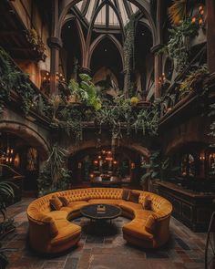 a living room filled with lots of plants next to a tall ceiling covered in windows