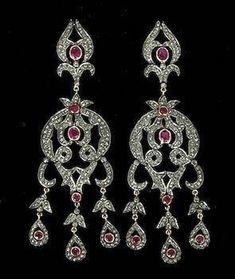 Handmade item Recycling: No Earring weight: 16.590 Grams Earring Length: 3.00 inches Earring width: 1.00 inches Gemstones: Natural Victorian Rose cut diamonds & Ruby Diamonds weight: 10.44 Carats Diamonds Colure: Light Tinted Diamonds Shape: Round Ruby weight: 6.80 Carats Ruby : Lab Created Material: Silver Silver purity: 925 Earring Finished: Antique & Gold Dangle Diamond Earrings With 17 Jewels For Wedding, Formal Silver Chandelier Earrings With 17 Jewels, Victorian Wedding Earrings In Diamond White, Victorian Diamond White Earrings For Wedding, Wedding Chandelier Earrings Fine Jewelry, Ornate Diamond Accent Earrings For Anniversary, Ornate Diamond Accented Earrings For Anniversary, Luxury Silver Hallmarked Chandelier Earrings, Exquisite Sterling Silver Chandelier Earrings With Diamond Accents