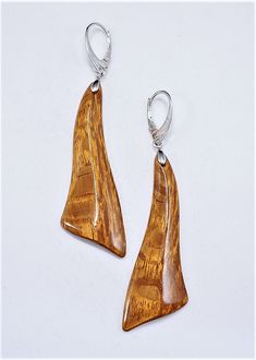 The earrings are one of a kind and handmade from Lace wood and have very smooth and brilliant cut surface.  Lever backs are Silver plated. Care instructions: Avoid direct contact with perfumes, alcohol, water and other solvents that may damage wood finish. Wipe jewelry with soft dry cloth. Brown Wooden Earrings As Gift, Modern Brown Earrings For Formal Occasions, Unique Brown Wooden Earrings, Artisan Brown Wooden Earrings, Artisan Brown Wood Earrings, Unique Natural Wood Earrings, Modern Brown Earrings For Gift, Elegant Natural Wood Jewelry For Gift, Elegant Brown Wooden Jewelry