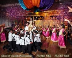 a group of people dancing on a wooden floor