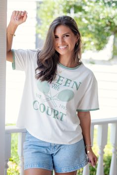 $27.50 Original price was: $27.50.$22.00Current price is: $22.00. Queen of the Court T-Shirt https://www.batessistersboutique.com/product/queen-of-the-court-t-shirt/ Approx. Measurements in Inches  S  M  L      Length  24  24.5  25      Bust  36  38  40          Bates Sisters Boutique Spring Cream Soft-washed Tops, Soft-washed Cream Top For Spring, Spring Soft-washed Cream Top, Spring Cream Soft-washed Top, Bates Sisters Boutique, 50th Clothing, Open Knit Cardigan, Plus Dresses, Purse Jewelry