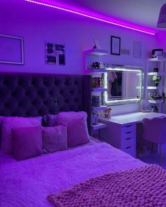 a bedroom with purple lighting in the ceiling