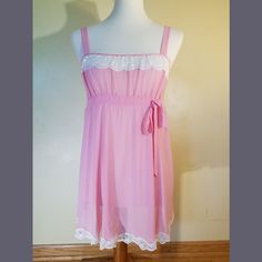 Empire Waist, Bubblegum Pink Cami With White Lace Detail And Adjustable Straps. Never Worn, Only Tried On. This One Is Sweet And Sexy! Sheer 100% Poly. Machine Wash/Tumble Dry Low. Rare Find!! Pink Camisole For Daywear, Victoria's Secret Lace Trim Camisole For Daywear, Victoria's Secret Pink Sleeveless Nightgown, Pink Sleeveless Victoria's Secret Nightgown, Feminine Sleeveless Camisole For Bedtime, Sheer Pink Camisole For Daywear, Sleeveless Coquette Camisole For Bedtime, Fitted Lace Trim Camisole For Sleepover, Coquette Sleeveless Camisole For Bedtime