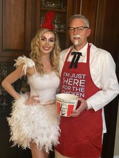 a man and woman dressed up in costumes posing for a photo with a cup of coffee