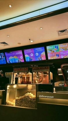 there are many menus on the wall above the food counter at this eatery