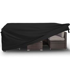 an outdoor furniture covered with a black cover