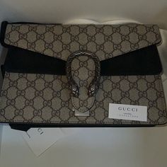 New Flap Medium Gucci Bag Perfect For Work Or Traveling Designer Gucci Bag With Branded Hardware, Designer Gucci Shoulder Bag With Horsebit Detail, Designer Gucci Bag With Horsebit Detail, Designer Gucci Clutch Shoulder Bag, Designer Gucci Clutch Bag, Luxury Gucci Clutch Bag, Luxury Shoulder Bag With Horsebit Detail, High-end Black Gucci Shoulder Bag, Rectangular Gucci Bag