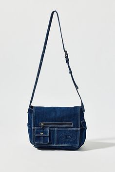 Essential messenger bag crafted from premium BDG denim. Low-profile silhouette with a pocketed flap closure. Lined interior with two pockets and plenty of space for your essentials. Complete with a zip pocket at the back for easy access, plus a water bottle pocket at the side. Finished with an adjustable strap - wear it on your shoulder or crossbody. Urban Outfitters exclusive. Features BDG denim messenger bag Washed soft denim with tons of storage Plenty of pockets inside and out Water bottle p Denim Side Bag, Denim Messenger Bag, Profile Silhouette, Urban Outfitters Jeans, Jeans Bag, Side Bags, Raw Denim, Brand Sale, Easy Access