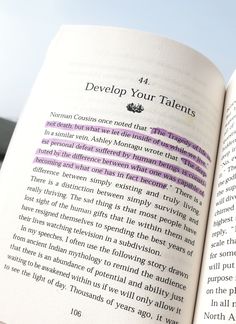 an open book with the words developing your talent written in purple and black on it