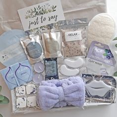 the contents of a baby gift box are laid out