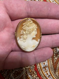 Lovely vintage 10k Cameo Brooch and Pendant. This vintage Cameo is very well carved. This Lovely Lady would make a wonderful Mother's Day.  I only ship within the USA and all sales are Final. Heirloom Cameo Brooches For Collectors, Antique Yellow Gold Collectible Brooches, Antique Yellow Gold Brooches Collectible, Antique Gold Intaglio Brooches, Carved Yellow Gold Brooches, Gold Oval Carved Brooches, Oval Carved Gold Brooches, Heirloom Style Carved Brooch For Gifts, Heirloom Carved Brooches As Gift