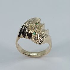 This stunning Emerald and Diamond Ring has been carefully crafted in warm 10k Yellow Gold, authentic Emerald and White Diamonds. This ring will make an unforgettable anniversary/birthday/special occasion gift! If you love emeralds you have found the perfect ring ."Emerald is a Seeker of Love and a Revealer of Truth, inspiring an ongoing search for meaning, justice, compassion and harmony." All of my jewelry is handmade from scratch and of high quality. Ring can be resized at no extra cost and it Art Deco Yellow Gold Emerald Ring For Anniversary, Gold Rings With Accent Stones For Anniversary, Gold Art Deco Diamond Ring With Accent Stones, Anniversary Green 14k Stamped Signet Ring, Green 14k Gold Diamond Ring For Anniversary, Green 14k Gold Rings For Anniversary, Green Diamond 14k Gold Ring For Anniversary, Art Deco Gold Diamond Ring With Accent Stones, Green Diamond Ring In 14k Gold For Anniversary