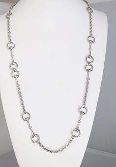 This silver chain necklace is a classic. It's a great everyday piece that you can wear with anything. The chain is made of sterling silver, which is a durable metal that will last for years. The necklace is also adjustable, so you can customize the length to suit your personal style. Classic Silver Metal Chain Necklace, Long Silver Chain Necklace, Formal Metal Chain Necklace, Formal Silver Chain Link Necklace, Silver Chain Necklace With Oval Link And Gold Chain, Silver Jewelry With Chain Strap As Gift, Silver Jewelry With Chain Strap For Gift, Classic Silver Jewelry With Chain Strap, Silver Jewelry With Oval Link Chain Strap