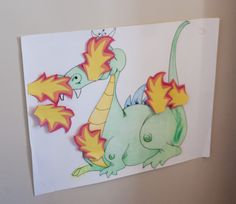 a drawing of a green and yellow dragon with flames on it's back legs