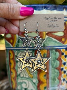 Be unique and stylish with the Star Gazer Dangle Earrings! Offering an eye-catching western look, these earrings have the perfect mix of chic and statement style. Make a memorable style statement with this unique jewelry! Stamped Sterling Silver 2.5 " L X 1.5" W Non-Native Bohemian Star-shaped Nickel-free Earrings, Bohemian Silver Star-shaped Earrings, Bohemian Silver Star Earrings, Unique Dangle Linear Earrings, White Bin, Horse Hair Pottery, Star Dangle Earrings, Western Look, Silver Dangle Earrings