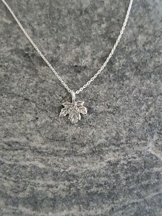 "Tiny sterling silver leaf. This tiny pendant measures 9mm across and is made of solid sterling silver. It hangs from a delicate sterling chain and has a shiny finish with a slightly antiqued look to give the grains in the leaf more texture. Sweet and delicate everyday necklace! Shown here in 16\" length. *If you are unsure of the length you need, or would like to wear this item at different lengths, we now offer an adjustable length option! You can add an adjustable end to your necklace using t Sterling Silver Leaf-shaped Jewelry Gift, Everyday Sterling Silver Leaf Jewelry, Dainty Hallmarked Sterling Silver Charm Necklaces, Dainty Hallmarked Sterling Silver Charm Necklace, Small Hypoallergenic Sterling Silver Charm Necklaces, Small Hypoallergenic Sterling Silver Charm Necklace, Silver Leaf-shaped Sterling Silver Necklace, Dainty Sterling Silver Leaf Jewelry, Tiny Sterling Silver Necklace In Silver