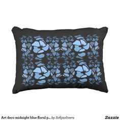 a black and blue pillow with an abstract design on the front, in shades of blue