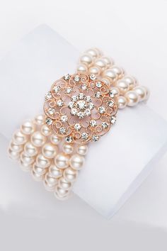 This sumptuous piece of jewelry features a retro-elegant yet slightly modern style that complements the lavish garments, reminiscent of the roaring 1920s. Features: High quality Austrian crystals and imitation pearls Five strand design 5.5 inch / 14cm in diameter 8mm pearls Roaring 20s Accessories, 20s Accessories, 1920s Accessories, 1920s Jewelry, Beaded Evening Bags, Women's Bracelets, Roaring 20s, Ladies Clutch, Crystal Decor