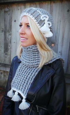 a woman wearing a knitted hat and scarf