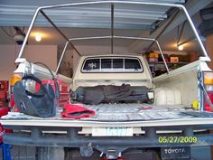 the back end of a pick up truck in a garage