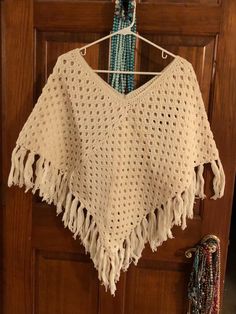 Vintage handmade poncho. Excellent condition. Color is cream ( off white). All handmade, no spots, no pulled threads. Measurements are 36" wide & 28" long. Smoke free home & free shipping! Happy shopping 🛍️ Casual White Poncho Shawl, Casual White Shawl Poncho, Cream Casual Poncho One Size, Handmade Beige Poncho One Size, Cream Casual Poncho, One Size Fits All, Bohemian One Size Cream Poncho, Beige One Size Shawl Poncho, Beige One Size Poncho For The Beach, Beige Shawl Poncho For Beach