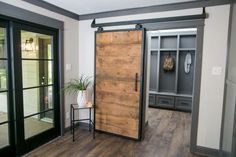 an empty room with sliding glass doors and wood flooring