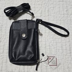 <> Nwt | Never Used <> Jacqui Btl Made With Black Vegan Leather | Interior Made With 100% Recycled Plastic Bottles And Lined With Rdif Identity Protecting Material <> Many Ways To Use - Long Removable Leather Strap For Crossbody Wear, Short Removable Leather Strap To Wear As Wristlet, Or As A Regular Wallet - Extra Clip On The Side To Hold Keys Or Attach To Other Things <> Large External Phone Pocket With Snap Button Strap Closure <> Zipper Opening <> 9 Interior Pockets/Slots And One Interior Zi Black Travel Wristlet With Cell Phone Pocket, Travel Black Wristlet With Cell Phone Pocket, Black Wristlet With Cell Phone Pocket For Everyday, Black Wristlet Pouch With Cell Phone Pocket, Black Wristlet With Adjustable Strap For Daily Use, Black Wristlet With Cell Phone Pocket, Black Wristlet With Cell Phone Pocket For Gift, Black Wristlet With Cell Phone Pocket As Gift, Black Wristlet Mobile Phone Bag For Everyday Use