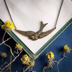 Sparrow In Flight Vintage Style Necklace available in Antiqued Brass o | Ragtrader Vintage Antique Silver Necklace For Vintage Collection, Antique Brass Necklace Nickel Free, Antique Gold Necklace With Oxidized Finish, Antique Silver Brass Necklace Vintage Style, Vintage Brass Necklaces, Antique Brass Nickel-free Necklace, Antique Silver Engraved Brass Necklace, Antique Brass Necklace With Oxidized Finish, Antique Silver Brass Necklaces For Vintage Collection