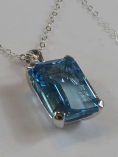 Fine Silver Large Emerald Cut Blue Topaz Pendant Necklace - Etsy Classic Blue Rectangular Necklace, Blue Rectangular Topaz Jewelry, Blue Rectangular Faceted Jewelry, Modern Blue Jewelry With Rectangular Stone, Blue Square Cut Gemstone Jewelry, Classic Aquamarine Rectangular Jewelry, Classic Rectangular Aquamarine Jewelry, Blue Rectangular Necklace For Anniversary, Rectangular Blue Birthstone Jewelry