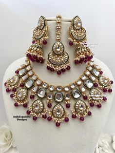 Premium quality Kundan Necklace comes with elegant Jhumki Earrings and Tikka/ trendy Indian bridal set/Premium Quality Polki and Kundan Jewelry/wine purple  All items are shipped from Brampton, Ontario, Canada. If you need your item by a certain day, please reach out to us for express delivery option before placing the order so that we can update the shipping for you. Standard shipping/delivery timeline Below are the delivery timeline estimates. We dispatch all orders by the next business day. - Kundan Multi-stone Necklace For Wedding, Luxury Multi-stone Kundan Necklace For Wedding, Elegant Dual-tone Kundan Bridal Necklace, Festive Dual-tone Kundan Bridal Necklace, Luxury Kundan Multi-stone Necklace, Wine Purple, Kundan Necklace Set, Brampton Ontario, Kundan Jewelry