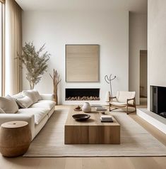 a modern living room with white furniture and wood accents