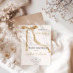 a new year's eve baby shower with gold foil on the front and back