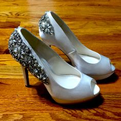 Pair Of Ivory Satin Peep Toe Pumps With Rhinestone, Pearl, And Silver Beading Details By Paradox London Pink. 5 Inch Heel With 1 Inch Platform Under Toe. Brand New, Never Worn, And Still In Original Box. Great For Brides And Weddings! Fitted Silver Wedding Shoes With 4-inch Heel, Fitted Silver Embellished Heels, Silver Round Toe Wedding Shoes With Rhinestones, Silver Rhinestone Wedding Shoes With Round Toe, Silver Wedding Shoes With Rhinestones And Round Toe, Silver Glamorous Fitted Wedding Shoes, Silver Glamorous Wedding Shoes, Silver Open Toe Fitted Wedding Shoes, Silver Embellished Heels With Almond Toe