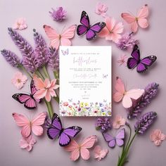 a wedding card surrounded by pink and purple flowers with butterflies around it on a lilac background