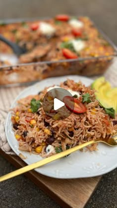 a white plate topped with rice and vegetables