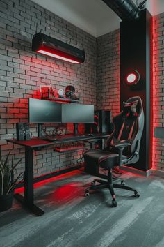 a room with a desk, computer chair and red lights on the wall behind it