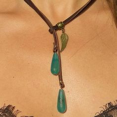 Bohemian Leather Necklace For Festivals, Handmade Bohemian Leather Necklace, Bohemian Leather Pendant Necklace, Bohemian Leather Lariat Jewelry, Bohemian Leather Dangle Jewelry, Bohemian Green Resizable Jewelry, Green Bohemian Resizable Jewelry, Festival Leather Jewelry With Adjustable Cord, Bohemian Leather Jewelry