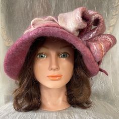 Wet Felted  merino wool and bamboo silk cloche .  Mannequin head size is 21 , will fit 22,-23,5 inches created as one of a kind.Feel free to email me any questions. Thanks. Elegant Handmade Winter Hats, Elegant Burgundy Hat For Winter, Elegant Handmade Felt Hat For Kentucky Derby, Fitted Pink Brimmed Cloche Hat, Pink Fitted Mini Hat For Winter, Fitted Pink Mini Hat For Winter, Pink Wide Brim Cloche Hat For Winter, Elegant Pink Felt Hat With Curved Brim, Pink Winter Felt Hat With Short Brim