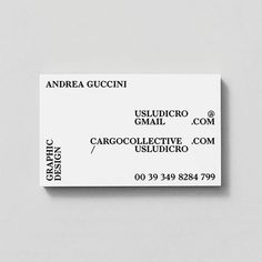 a white business card sitting on top of a table