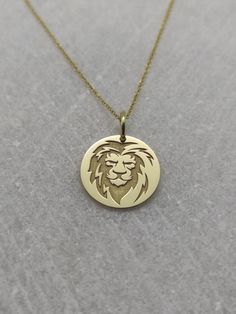 "Lion Necklace - Engraved Lion Charm - Gold Graduation Charm - Gold Navy Pendant ▪️ A beautiful and clean engraved Lion pendant made out of 14K Solid Real Gold. Available only in yellow gold! Pendant Thickness: 0.50mm Jump Ring inner diameter: 4mm Dimensions - Small - 13x13mm / 0.51 x 0.51 inches Medium - 14x14mm / 0.55 x 0.55 inches Big - 15x15mm / 0.59 x 0.59 inches Necklace Length - You can choose your chain length from 35CM to 50CM. The pendant is available alone without a chain, select \"No Lion Pendant Gold, Lion Head Necklace, Ring Charm Necklace, Lion Charm, Wild Lion, Mens Silver Jewelry, Lion Necklace, Lion Pendant, Head Necklace