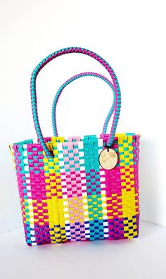 Multicolor Tote Bag Made From Recycled Plastic, Multicolor Beach Bag With Braided Handles For Everyday, Multicolor Square Straw Bag For Market, Everyday Multicolor Beach Bag With Braided Handles, Colorful Handwoven Shoulder Bag For Everyday Use, Everyday Multicolor Woven Beach Bag, Multicolor Woven Beach Bag For Market, Multicolor Basket Beach Bag With Weaving, Multicolor Woven Basket Beach Bag