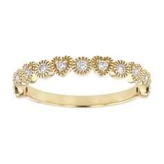 a yellow gold ring with five diamonds