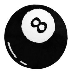 a black and white round rug with an eight - ball in the middle on it