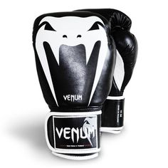 a pair of black and white boxing gloves with the word agasi printed on it