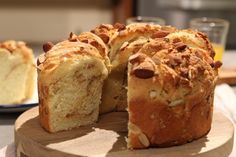 a bundt cake is cut into slices on a wooden board