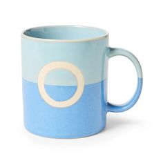 a blue and white coffee mug with a circle on the inside, sitting in front of a white background