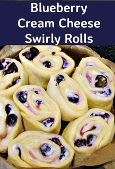 blueberry cream cheese swirly rolls are ready to be baked in the oven and eaten