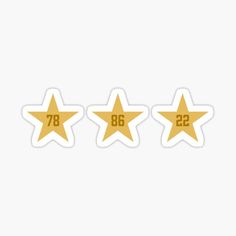 three gold stars with the number twenty six and one seven sticker