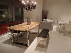 a wooden table sitting in the middle of a living room